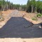 Stabilization fabric was placed over a wet area to build a road that could support trucks immediately.