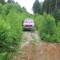 This would be considered a light rebuild with small bushes along ditches and on the road shoulder. Cross culverts may be plugged or damaged, and the road surface may need to have the grass and organics removed.  Rebuild conditions can change frequently along the same road.