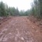 Old bulldozer roads with overburden along the sides can be too narrow to accommodate today’s logging trucks and floats. To maximize width, the crown tapers into the fore-slope of the ditch to maximize running surface.